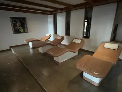 a row of chairs in a waiting room at PIRIN GOLF DELUXE PRIVATE STUDIO GABBY ground floor in Bansko