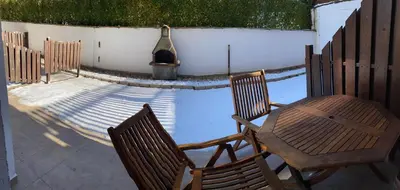 a patio with a table and chairs and a grill at Studio 4, 4min walk to slope at Predela2 Bansko in Bansko