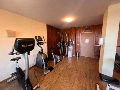 a gym with several exercise bikes in a room at Princeps De Cura Bansko in Bansko