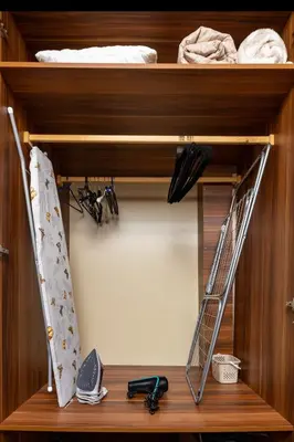 a wooden shelf with a ladder in a bedroom at Square Slivnitsa 2BR apt 5 minutes from top center in Plovdiv
