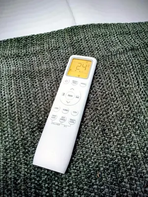 a remote control sitting on top of a couch at GuestHouse1 Karma369 in Plovdiv