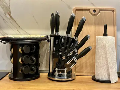 a group of knives and a knife block on a table at Casa Brisa by Vistay Residences Apartment Sofia - with Free Secured Parking in Sofia