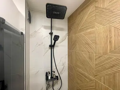 a shower in a bathroom with a shower at Casa Brisa by Vistay Residences Apartment Sofia - with Free Secured Parking in Sofia
