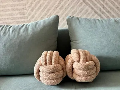 a pair of mitts sitting on top of a couch at Casa Brisa by Vistay Residences Apartment Sofia - with Free Secured Parking in Sofia