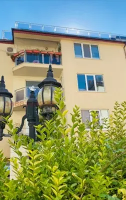 a street light in front of a building at Bulgaria Mall Flat in Sofia