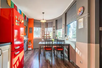 a kitchen and dining room with a table and chairs at Free parking 1BR Tokuda Lozenets in Sofia