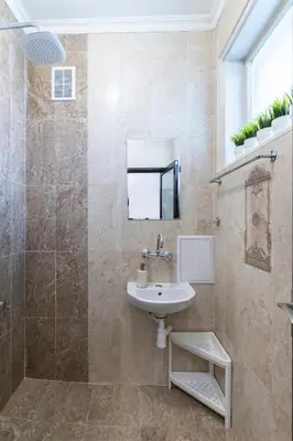 a bathroom with a sink and a shower at 2-Bedroom Apartment near Tokuda Hospital & Paradise Mall in Sofia
