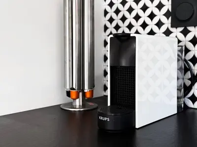 a black and white appliance sitting on a table at View, Location, High End Interior, Lift, AC in Sofia