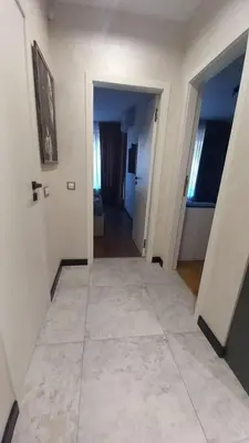 a room with a hallway with a tile floor at ATM apart Lagera in Sofia