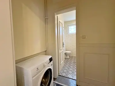 a laundry room with a washer and dryer at Romantic 1BDR apt near Eagle bridge - Fast Wi-Fi in Sofia