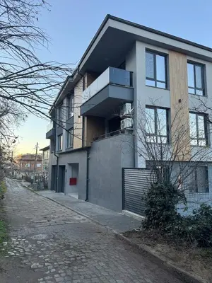 a building with a balcony on a street at MedHill Stay - Medical University Area in Plovdiv