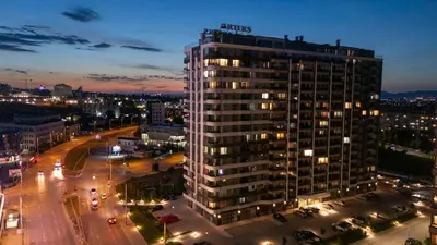 a tall building in a city at night at Wings Apartment 1 Bedroom Luxury-free parking in Sofia