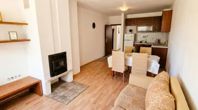 a living room with a couch and a table at Penthouse Duplex Large 2 Bedroom MP1 in Bansko