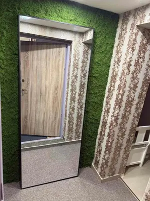 a door in a room with a green wall at Top Center Apartment Sofia in Sofia