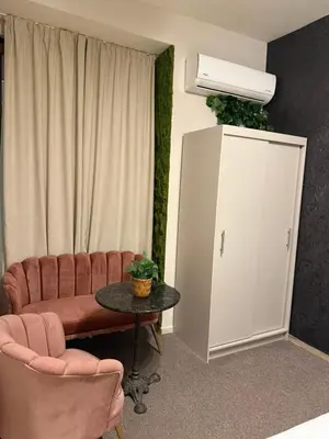 a living room with a couch and a table at Top Center Apartment Sofia in Sofia