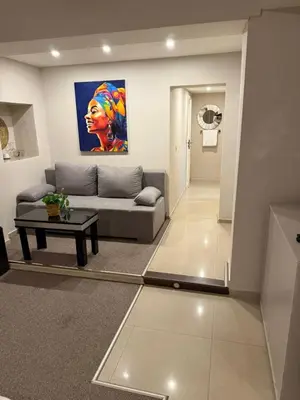 a living room with a couch and a table at Top Center Apartment Sofia in Sofia