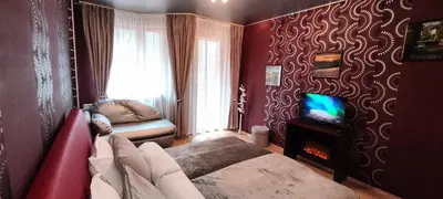 a living room with a couch and a tv in a room at Iceberg Studio 15 in Borovets