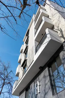 a white building with windows on top of it at Plovdiv Hills Apartments with FREE Parking in Plovdiv