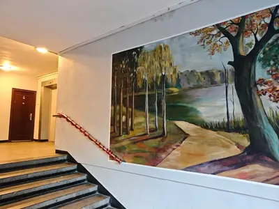 a painting on the wall of a building with stairs at Apartment M 1 in Plovdiv