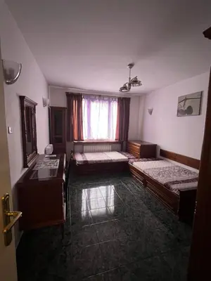 a room with two beds and a window at EAST Spacious and Comfort Apartment in the best suburb in Sofia in Sofia