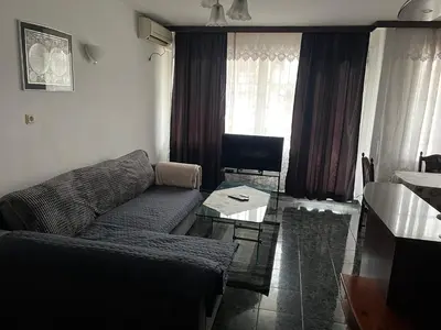 a living room with a couch and a table at EAST Spacious and Comfort Apartment in the best suburb in Sofia in Sofia