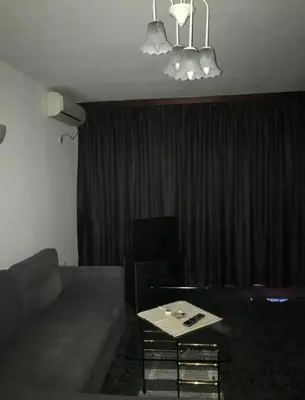 a living room with a couch and a table at EAST Spacious and Comfort Apartment in the best suburb in Sofia in Sofia