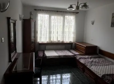 a room with two beds and a window at EAST Spacious and Comfort Apartment in the best suburb in Sofia in Sofia