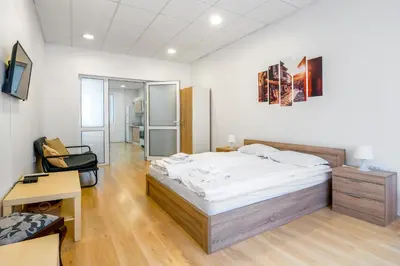 a bedroom with a bed and a desk and a chair at Top Centre 2BDR Apartment for 4 Guests next to Theater Tear and Laughter in Sofia