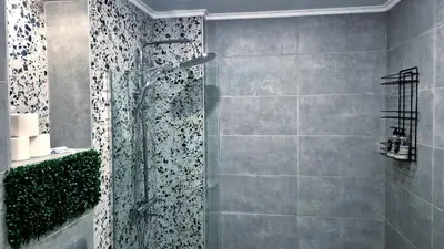 a shower with a glass door in a bathroom at Spacious 3 BDR City Pulse near Airport, The Mall, Arena 8888 by KeyBox in Sofia