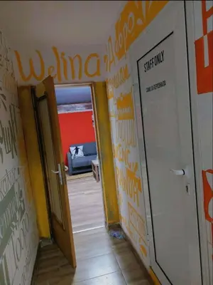 a hallway with an open door in a room at MOTEL Route 80 in Bozhurishte