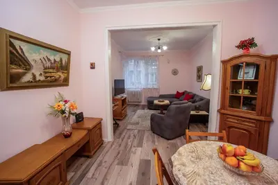a living room with a dining table and a living room at Alex's Charming Apartment by NDK in Sofia