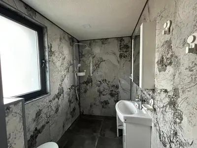 a bathroom with a sink and a mirror at Къща за гости Алино Хаус in Alino
