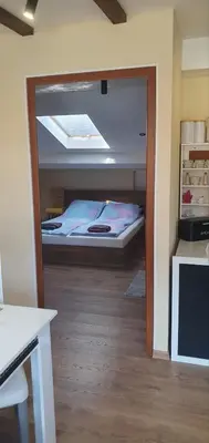 a small bedroom with a bed in a room at Къща за гости ОЗИ 3 in Ovchartsi