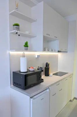 a kitchen with a microwave on a counter at White Peaks 1BR Apartment Bansko by SI Stay in Bansko