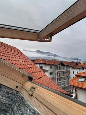 a view from the window of a roof at Belmont Apartment in Bansko