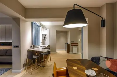 a kitchen and living room with a table and chairs at NDK - Grand View Apartment in Sofia