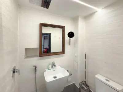 a white bathroom with a sink and a mirror at Near NDK - Washer&Dryer - Fast Wi-Fi - Kitchenette in Sofia