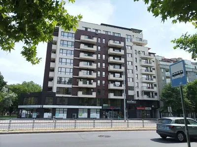 a tall apartment building on a city street at One Bedroom Apartment 4 - Restaurant Stadium Plovdiv in Plovdiv