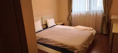 a bedroom with a bed with white sheets and a window at One Bedroom Apartment 2 - Restaurant Stadium Plovdiv in Plovdiv