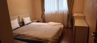 a bedroom with a bed with two towels on it at One Bedroom Apartment 2 - Restaurant Stadium Plovdiv in Plovdiv