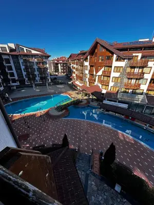 an overhead view of a swimming pool with buildings at BANSKO Deluxe Apartment Belvedere - 350m SkiLift in Bansko