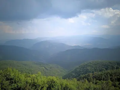 a view of a valley with trees and mountains at Малка Къщичка Бяла Черква