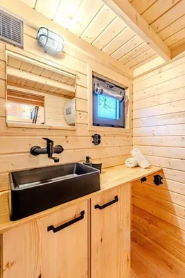 a kitchen with a sink in a tiny house at Малка Къщичка Бяла Черква
