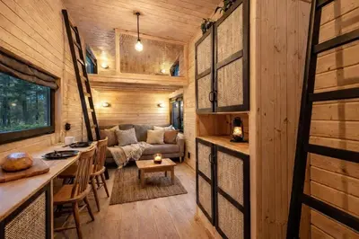 a living room of a tiny house with a couch at Малка Къщичка Бяла Черква