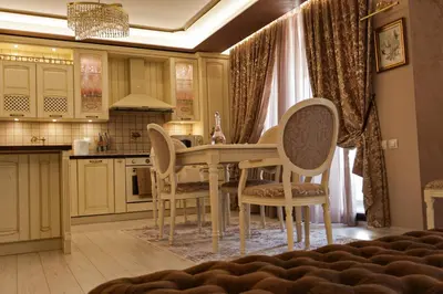 a kitchen with a dining room table and chairs at Апартамент за гости Марица in Asenovgrad