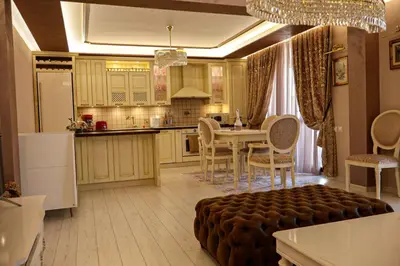 a kitchen with a table and a dining room at Апартамент за гости Марица in Asenovgrad