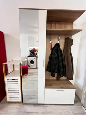 a closet with a door open in a kitchen at Warsaw Cozy Studio near UNSS and NSA with Balcony in Sofia