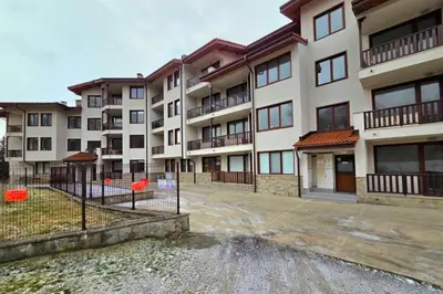 an empty parking lot in front of an apartment building at Apartment Lily Complex Padaloto in Smolyan