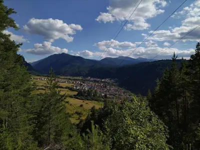 a view of a town in a valley with mountains at Sunny Studio Eagle Rock in Beli Iskar