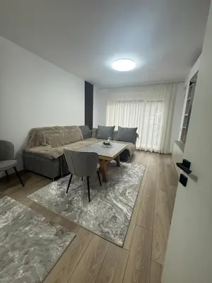 a living room with a couch and a table at River side apartment in Sandanski